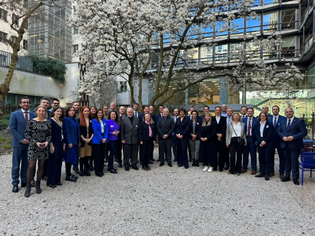 Paul Schonenberg and Susan Danger in the company of more than 20 Chairmen, Presidents, CEOs and staff members of the 45 AmChams in Europe. Photo taken in courtyard of AmCham EU's Brussels HQ on the event of the Transatlantic Conference 2024.